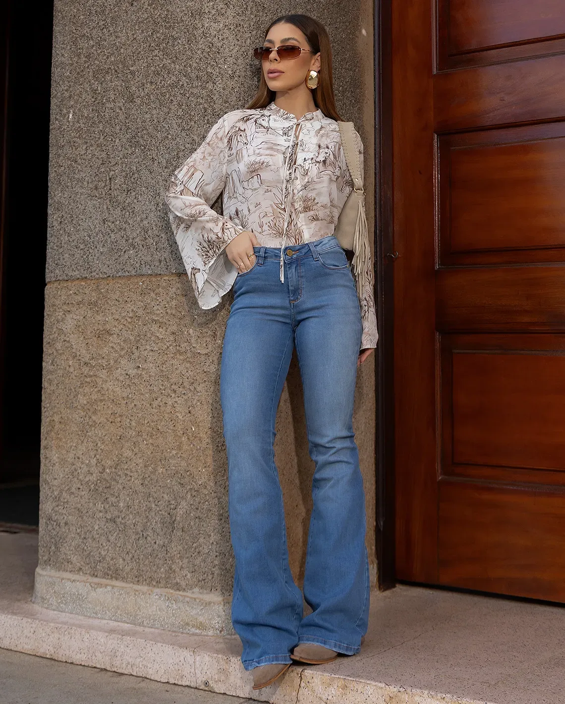 Calça Jeans Flare Clara Cintura Baixa Bolso